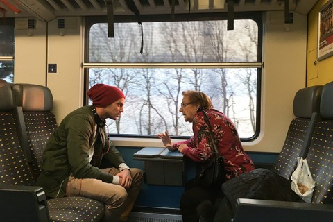 two people on train